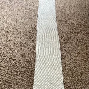 Michael Kohl’s very long white acrylic knit scarf